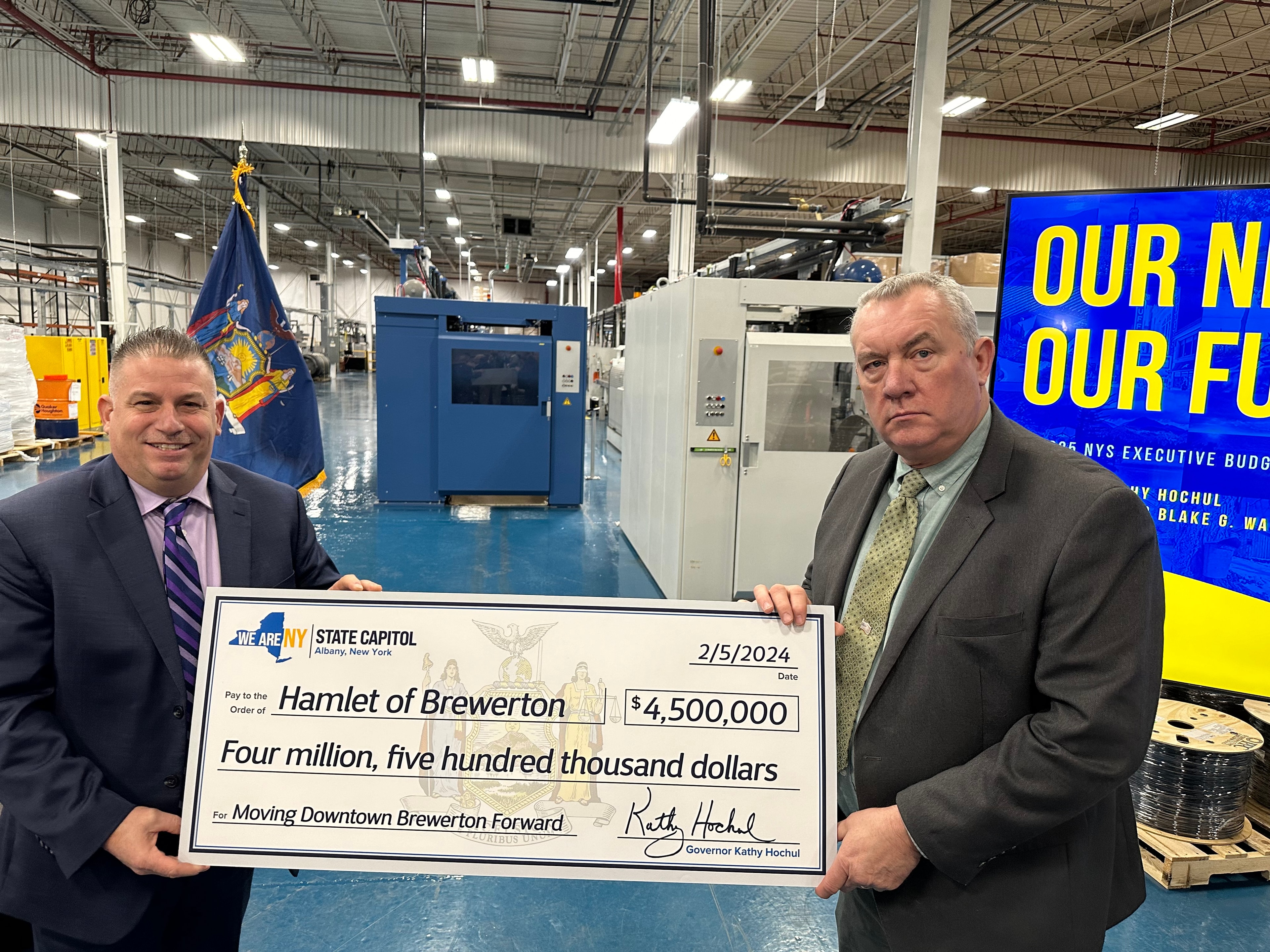 Mike Aregano holding $4.5 million NY Forward ceremonial check for the Hamlet of Brewerton